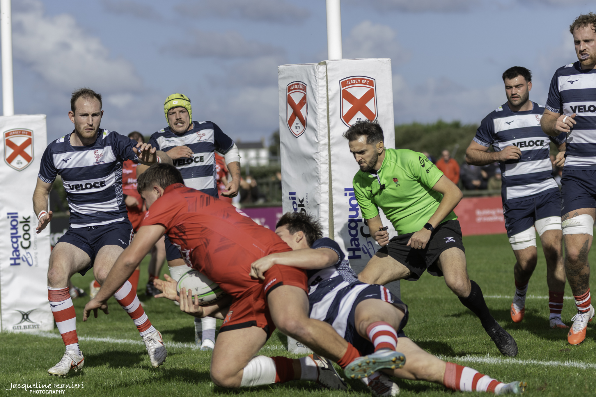 Jersey RFC, in red, scoring against Dorking at home